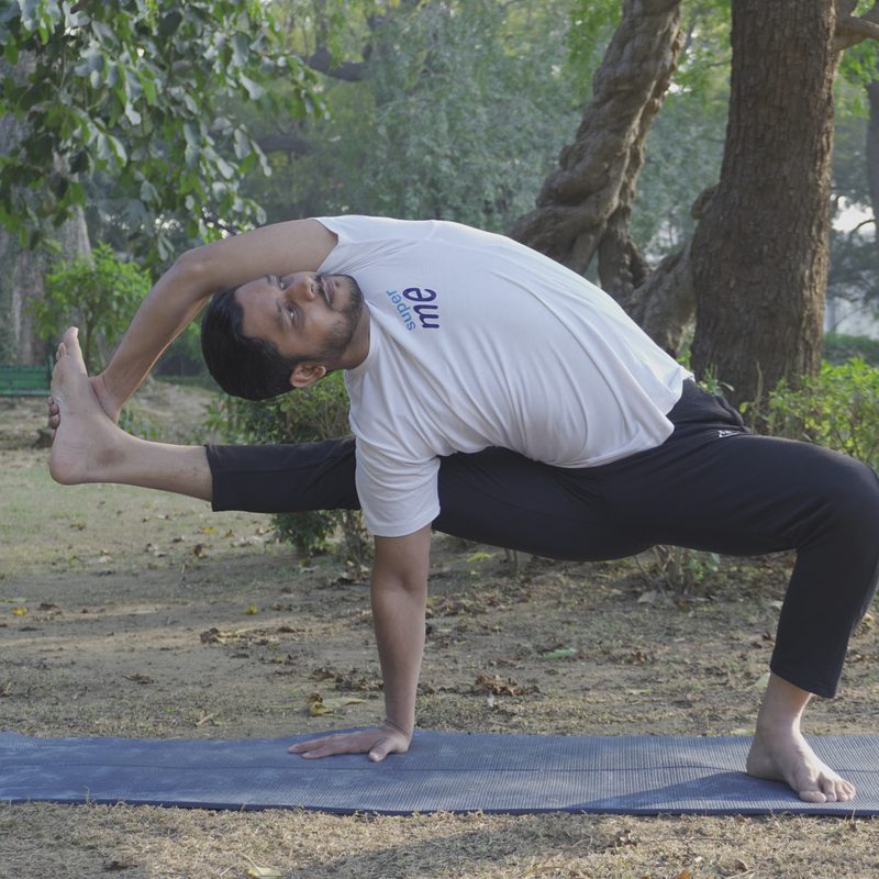 Atul Mishra in a standing side-angle posture from the Inner Brace Method